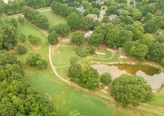 Aerial view of pond with trees