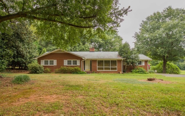 Original house surrounded by mature trees